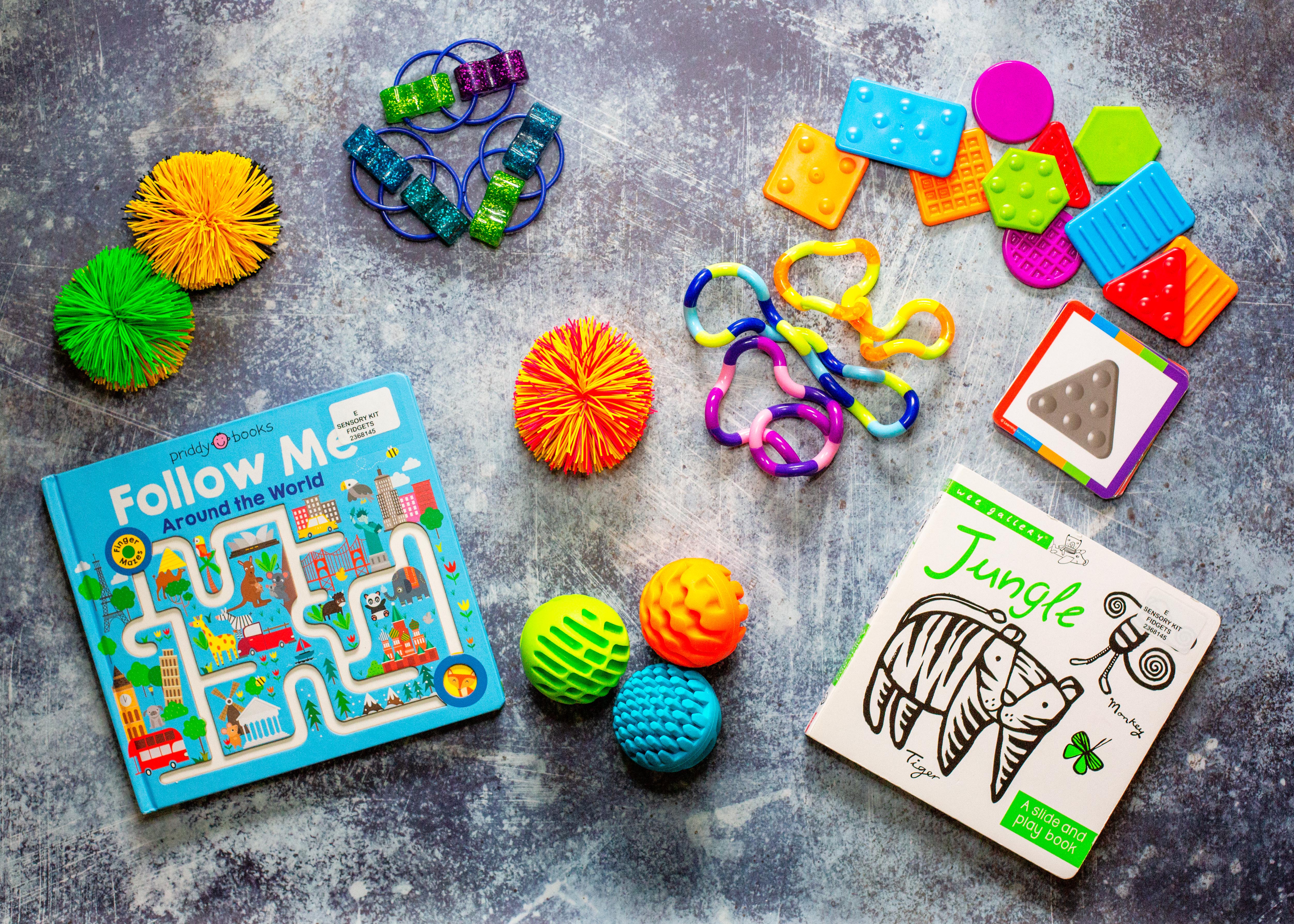 Teaching Tac-Tiles Koosh Balls Sensory Balls Sensory Rollers TANGLE Jr. Loopeez Fidgets Jungle: A Slide and Play Book by Surya Sajnani Follow Me Around the World by Roger Priddy Instructional Booklet Check For Availability